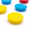 Colorful magnets set of 10 - Graphic design. Round magnets in yellow, blue, and red.