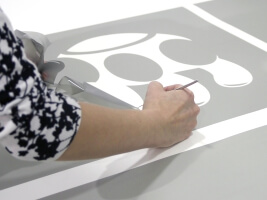 cutting the stencil from the film